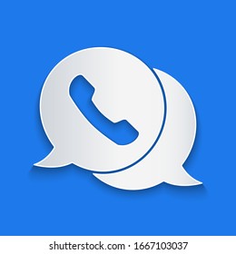 Paper cut Telephone with speech bubble chat icon isolated on blue background. Support customer service, hotline, call center, faq. Paper art style. Vector Illustration