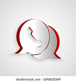 Paper cut Telephone with speech bubble chat icon isolated on grey background. Support customer service, hotline, call center, faq. Paper art style. Vector Illustration