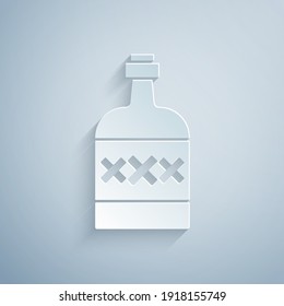 Paper cut Tequila bottle icon isolated on grey background. Mexican alcohol drink. Paper art style. Vector.