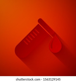 Paper cut Test tube or flask with drop of blood icon isolated on red background. Laboratory, scientific chemical glassware sign. Paper art style. Vector Illustration
