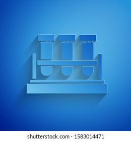 Paper cut Test tube and flask chemical laboratory test icon isolated on blue background. Laboratory glassware sign. Paper art style. Vector Illustration