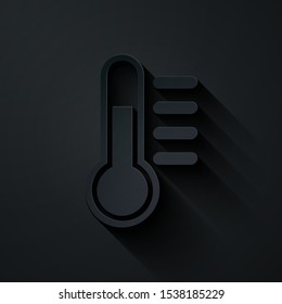 Paper cut Thermometer icon isolated on black background. Paper art style. Vector Illustration