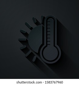 Paper cut Thermometer with sun icon isolated on black background. Paper art style. Vector Illustration