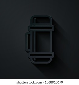 Paper cut Thermos container icon isolated on black background. Thermo flask icon. Camping and hiking equipment. Paper art style. Vector Illustration