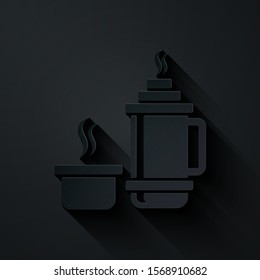 Paper cut Thermos container icon isolated on black background. Thermo flask icon. Camping and hiking equipment. Paper art style. Vector Illustration