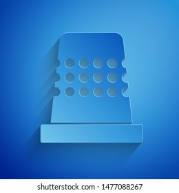 Paper cut Thimble for sewing icon isolated on blue background. Paper art style. Vector Illustration