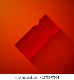 Paper cut Ticket icon isolated on red background. Paper art style. Vector Illustration