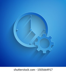 Paper cut Time Management icon isolated on blue background. Clock and gear sign. Productivity symbol. Paper art style. Vector Illustration