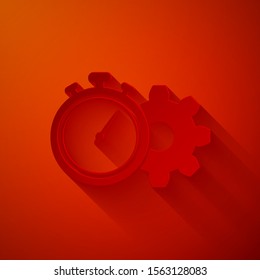 Paper cut Time Management icon isolated on red background. Clock and gear sign. Productivity symbol. Paper art style. Vector Illustration