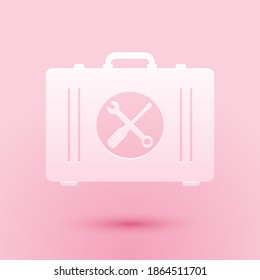 Paper cut Toolbox icon isolated on pink background. Tool box sign. Paper art style. Vector.