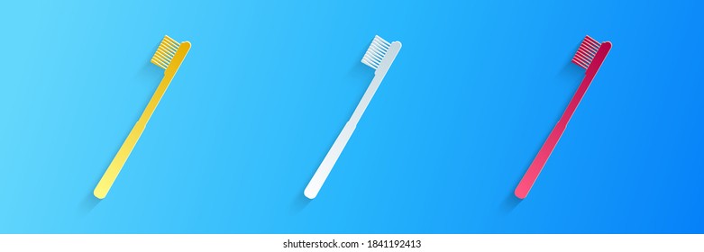 Paper cut Toothbrush icons isolated on blue background. Paper art style. Vector.