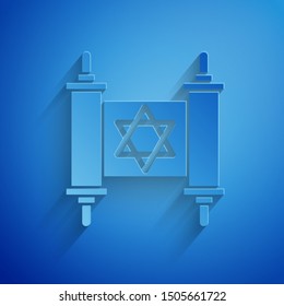 Paper cut Torah scroll icon isolated on blue background. Jewish Torah in expanded form. Star of David symbol. Old parchment scroll. Paper art style. Vector Illustration