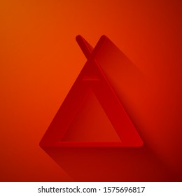 Paper cut Tourist tent icon isolated on red background. Camping symbol. Paper art style. Vector Illustration