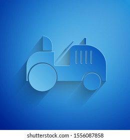 Paper cut Tractor icon isolated on blue background. Paper art style. Vector Illustration