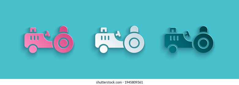 Paper cut Tractor icon isolated on blue background. Paper art style. Vector