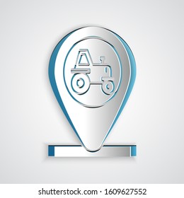 Paper cut Tractor and location icon isolated on grey background. Paper art style. Vector Illustration