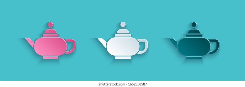 Paper cut Traditional Chinese tea ceremony icon isolated on blue background. Teapot with cup. Paper art style. Vector Illustration