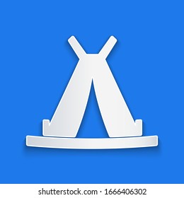 Paper cut Traditional indian teepee or wigwam icon isolated on blue background. Indian tent. Paper art style. Vector Illustration