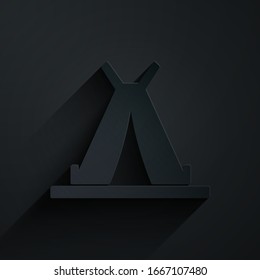 Paper cut Traditional indian teepee or wigwam icon isolated on black background. Indian tent. Paper art style. Vector Illustration