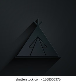 Paper cut Traditional indian teepee or wigwam icon isolated on black background. Indian tent. Paper art style. Vector Illustration
