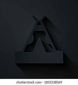 Paper cut Traditional indian teepee or wigwam icon isolated on black background. Indian tent. Paper art style. Vector.