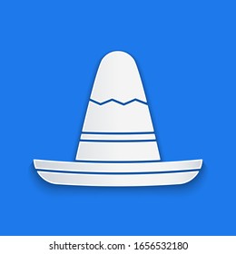 Paper cut Traditional mexican sombrero hat icon isolated on blue background. Paper art style. Vector Illustration