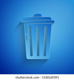 Paper cut Trash can icon isolated on blue background. Garbage bin sign. Recycle basket icon. Office trash icon. Paper art style. Vector Illustration