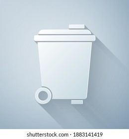 Paper cut Trash can icon isolated on grey background. Garbage bin sign. Recycle basket icon. Office trash icon. Paper art style. Vector