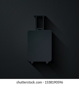 Paper cut Travel suitcase icon isolated on black background. Traveling baggage sign. Travel luggage icon. Paper art style. Vector Illustration