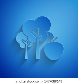 Paper cut Tree with apple icon isolated on blue background. Agricultural plant. Organic farm product. Gardening theme. Paper art style. Vector Illustration