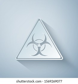 Paper cut Triangle sign with Biohazard symbol icon isolated on grey background. Paper art style. Vector Illustration