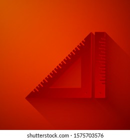 Paper cut Triangular ruler icon isolated on red background. Straightedge symbol. Geometric symbol. Paper art style. Vector Illustration