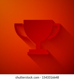 Paper cut Trophy cup icon isolated on red background. Award symbol. Champion cup icon. Paper art style. Vector Illustration