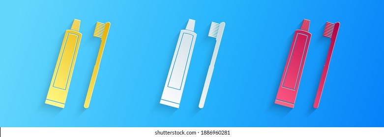 Paper cut Tube of toothpaste and toothbrush icon isolated on blue background. Paper art style. Vector.