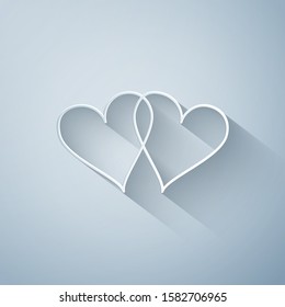 Paper cut Two Linked Hearts icon isolated on grey background. Heart two love sign. Romantic symbol linked, join, passion and wedding. Valentine day symbol. Paper art style. Vector Illustration