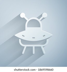 Paper cut UFO flying spaceship icon isolated on grey background. Flying saucer. Alien space ship. Futuristic unknown flying object. Paper art style. Vector