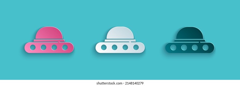 Paper cut UFO flying spaceship icon isolated on blue background. Flying saucer. Alien space ship. Futuristic unknown flying object. Paper art style. Vector