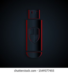Paper cut USB flash drive and protection shield icon isolated on black background. Paper art style. Vector Illustration