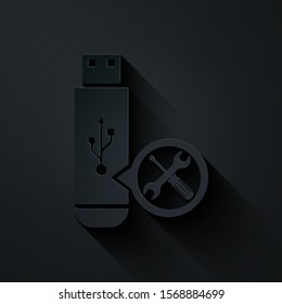 Paper cut USB flash drive with screwdriver and wrench icon isolated on black background. Adjusting, service, setting, maintenance, repair, fixing. Paper art style. Vector Illustration