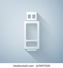 Paper cut USB flash drive icon isolated on grey background. Paper art style. Vector Illustration