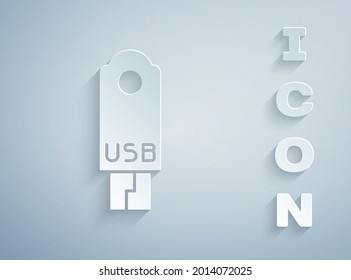 Paper cut USB flash drive icon isolated on grey background. Paper art style. Vector Illustration