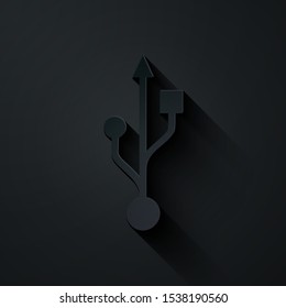 Paper cut USB symbol icon isolated on black background. Paper art style. Vector Illustration