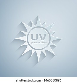 Paper cut UV protection icon isolated on grey background. Ultra violet rays radiation. SPF sun sign. Paper art style. Vector Illustration