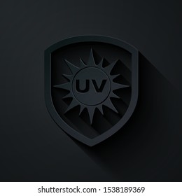 Paper cut UV protection icon isolated on black background. Sun and shield. Ultra violet rays radiation. SPF sun sign. Paper art style. Vector Illustration