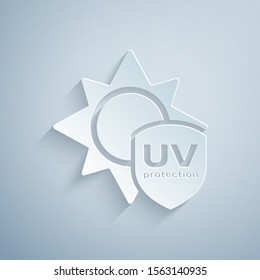 Paper cut UV protection icon isolated on grey background. Sun and shield. Ultra violet rays radiation. SPF sun sign. Paper art style. Vector Illustration