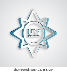 Paper cut UV protection icon isolated on grey background. Ultra violet rays radiation. SPF sun sign. Paper art style. Vector Illustration