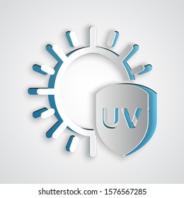 Paper cut UV protection icon isolated on grey background. Sun and shield. Ultra violet rays radiation. SPF sun sign. Paper art style. Vector Illustration