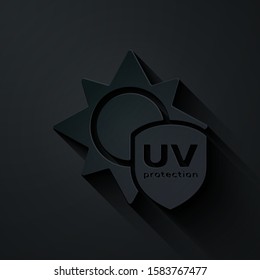 Paper cut UV protection icon isolated on black background. Sun and shield. Ultra violet rays radiation. SPF sun sign. Paper art style. Vector Illustration