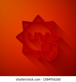Paper cut UV protection icon isolated on red background. Sun and shield. Ultra violet rays radiation. SPF sun sign. Paper art style. Vector Illustration