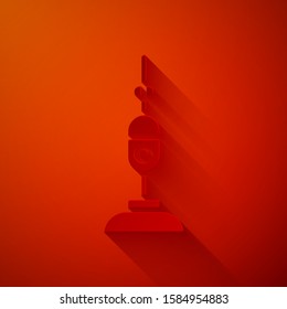 Paper cut Vacuum cleaner icon isolated on red background. Paper art style. Vector Illustration
